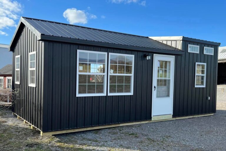 modern 14x20 cabin shed with a white door