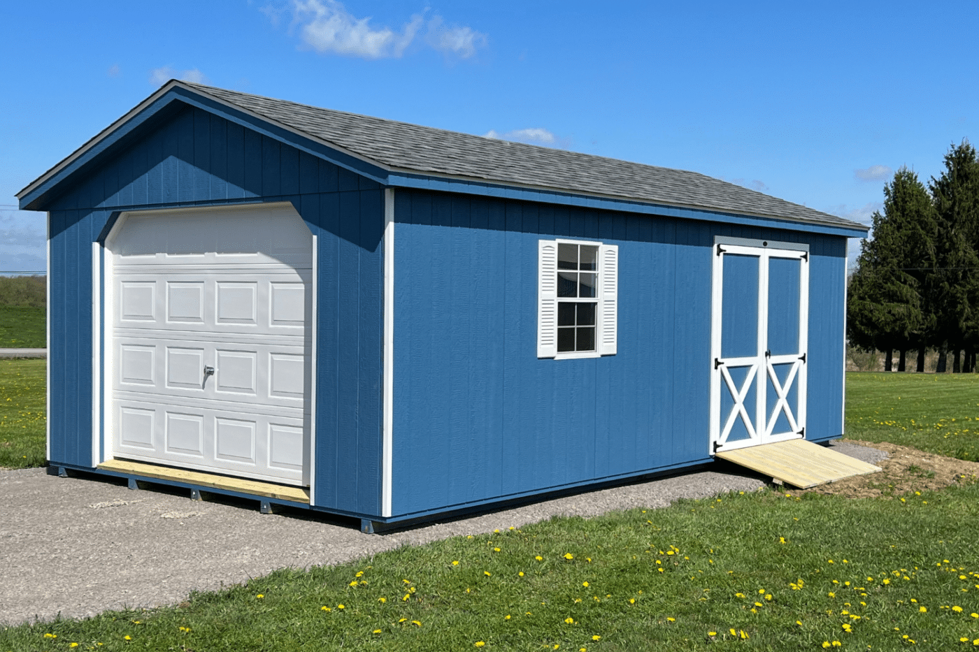 blue 12x30 garage with white door, window, and side double door with ramp in new york